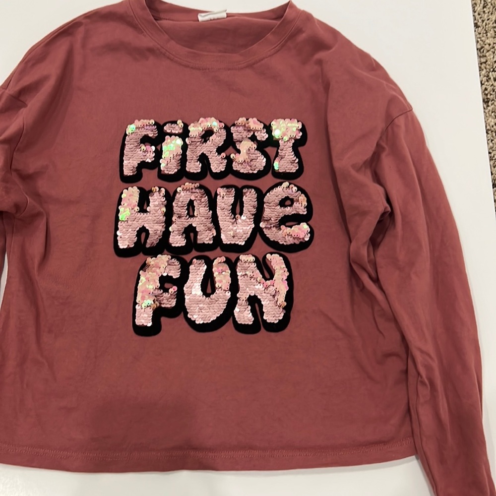 This is an Zara shirt that has reversible sequence